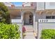 Welcoming front entrance with tiled steps and lush landscaping at 4859 Napoli Ne Ct # 4859, St Petersburg, FL 33703