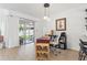 Well-lit office space with desk, chair, and slider to backyard patio at 4859 Napoli Ne Ct # 4859, St Petersburg, FL 33703