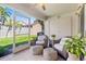 Inviting screened patio featuring comfortable seating and access to the lush backyard at 4859 Napoli Ne Ct # 4859, St Petersburg, FL 33703