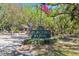 Community entrance sign for Placido Bayou with American flag at 4859 Napoli Ne Ct # 4859, St Petersburg, FL 33703