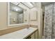 Bathroom featuring a shower, toilet, and single sink vanity at 5832 Sussex Dr, Tampa, FL 33615