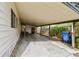 Spacious covered carport area offers ample parking and storage, plus convenient access to the home's entrance at 5832 Sussex Dr, Tampa, FL 33615