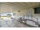 Covered carport entry provides convenient access to the home, featuring a small porch and minimal landscaping at 5832 Sussex Dr, Tampa, FL 33615