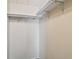 Walk-in closet with rods for hanging clothes at 5832 Sussex Dr, Tampa, FL 33615