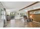 Inviting living room with wood floors, ample natural light, and access to an outdoor patio at 5832 Sussex Dr, Tampa, FL 33615