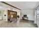 Spacious living room with wood floors and a comfortable recliner, offering a relaxing atmosphere at 5832 Sussex Dr, Tampa, FL 33615