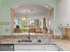 Open kitchen offers a breakfast bar overlooking the living space and backyard at 6021 Bahia Del Mar Cir # 137, St Petersburg, FL 33715