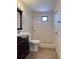 Functional bathroom with tiled walk-in shower, modern vanity, and fixtures that blend classic and practical at 6420 N Thatcher Ave, Tampa, FL 33614