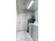 Practical laundry room featuring a washer, dryer, and utility sink, offering essential household convenience at 6420 N Thatcher Ave, Tampa, FL 33614