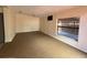 Spacious living room with neutral carpet and ample natural light, showcasing a serene and inviting atmosphere at 6420 N Thatcher Ave, Tampa, FL 33614