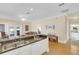 Bright kitchen and view of the comfortable living room with access to the back porch at 7701 N Dartmouth Ave, Tampa, FL 33604