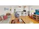 Open concept living room provides comfortable seating, a bar, and open access to the kitchen at 7701 N Dartmouth Ave, Tampa, FL 33604