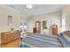 Beautiful bedroom with natural light, hardwood floors, and ensuite bath at 7701 N Dartmouth Ave, Tampa, FL 33604