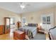 Charming bedroom features ensuite bathroom and dual windows that provide an abundance of light at 7701 N Dartmouth Ave, Tampa, FL 33604