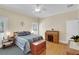 Sunny bedroom with neutral walls, hardwood floors, and ensuite office area at 7701 N Dartmouth Ave, Tampa, FL 33604