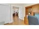Bright home office with an open floorplan, built-in shelves, and wood-look floors at 7701 N Dartmouth Ave, Tampa, FL 33604