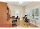 Bright home office with hardwood floors, a ceiling fan, and lots of natural light at 7701 N Dartmouth Ave, Tampa, FL 33604