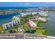 Aerial view of community with bays, waterways, and residences at 8020 Sailboat Key S Blvd # 101, St Pete Beach, FL 33707