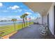 Enjoy waterfront views from this balcony featuring plenty of space for relaxing and entertaining at 8020 Sailboat Key S Blvd # 101, St Pete Beach, FL 33707