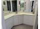 Bathroom featuring a large mirror, tiled countertop, cabinets, and open access to the shower at 8020 Sailboat Key S Blvd # 101, St Pete Beach, FL 33707