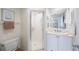 Bathroom with a white vanity, step-in shower, and neutral decor at 8020 Sailboat Key S Blvd # 101, St Pete Beach, FL 33707