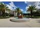 Beautiful landscaped courtyard with a fountain, offering a peaceful and inviting atmosphere at 8020 Sailboat Key S Blvd # 101, St Pete Beach, FL 33707