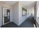 Well-lit hallway with windows and neutral color palette at 8020 Sailboat Key S Blvd # 101, St Pete Beach, FL 33707