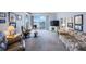Bright living room with comfortable seating and access to the private balcony overlooking the water at 8020 Sailboat Key S Blvd # 101, St Pete Beach, FL 33707