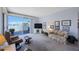 Relaxing living room with waterfront views from the outside balcony at 8020 Sailboat Key S Blvd # 101, St Pete Beach, FL 33707