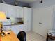 Bright office with built-in cabinets and drawers, offering ample storage and workspace at 8020 Sailboat Key S Blvd # 101, St Pete Beach, FL 33707