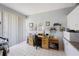 Office with tile floors, a desk, a rolling office chair, and a window with blinds at 8020 Sailboat Key S Blvd # 101, St Pete Beach, FL 33707