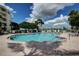 Inviting community pool with comfortable lounge chairs and well-maintained deck at 8020 Sailboat Key S Blvd # 101, St Pete Beach, FL 33707