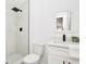 Modern bathroom featuring a walk-in shower with black fixtures and a white vanity with marble countertop at 8902 N Hamner Ave, Tampa, FL 33604