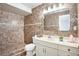 Tiled bathroom featuring a walk-in shower, vanity with storage, providing a luxurious feel at 8902 N Hamner Ave, Tampa, FL 33604