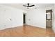 Bright bedroom with hardwood floors, doors to bathroom, closet and backyard providing connectivity at 8902 N Hamner Ave, Tampa, FL 33604