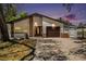 Charming single-story home with stone accents, a two-car garage, and a well-maintained front yard at 8902 N Hamner Ave, Tampa, FL 33604