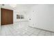 Spacious living room featuring stylish wall accents, tile flooring, and ample natural light from the window at 8902 N Hamner Ave, Tampa, FL 33604