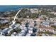 An aerial view showcases the neighborhood with lush surroundings and proximity to the waterfront and city at 946 Highland Ave # 23, Dunedin, FL 34698