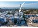 Aerial view of the townhomes and their proximity to the water, and convenient access to nearby amenities at 946 Highland Ave # 23, Dunedin, FL 34698