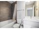 Bathroom featuring a shower-tub combination and vanity with modern finishes at 946 Highland Ave # 23, Dunedin, FL 34698