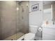 Bathroom featuring a tiled glass shower and vanity with modern finishes at 946 Highland Ave # 23, Dunedin, FL 34698