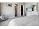 Bright bedroom with a television, walk-in closet, and ensuite bathroom, all contributing to a comfortable and convenient living space at 946 Highland Ave # 23, Dunedin, FL 34698