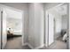 Neutral hallway with multiple rooms including a bedroom with a teal bed frame at 946 Highland Ave # 23, Dunedin, FL 34698