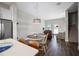 Living room with a combination of table seating, comfortable lounge furniture, and access to the outside at 946 Highland Ave # 23, Dunedin, FL 34698