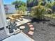 Landscaped backyard featuring a picnic table, mulch beds and walkway pavers, offering a cozy outdoor retreat at 9790 66Th N St # 346, Pinellas Park, FL 33782