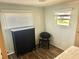 Bright bedroom with laminate flooring, neutral walls, and closet space at 9790 66Th N St # 346, Pinellas Park, FL 33782