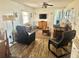 Cozy living room featuring comfortable seating, natural light, and wood-look flooring at 9790 66Th N St # 346, Pinellas Park, FL 33782