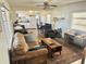 Inviting living room with wood floors, comfortable seating, and lots of natural light at 9790 66Th N St # 346, Pinellas Park, FL 33782