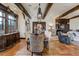 Elegant dining room with a wooden table, decorative light fixture, and custom cabinetry at 1102 Palm View Ave, Belleair, FL 33756