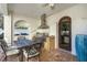 The outdoor kitchen has stainless steel appliances, and dining area for alfresco entertaining at 1102 Palm View Ave, Belleair, FL 33756